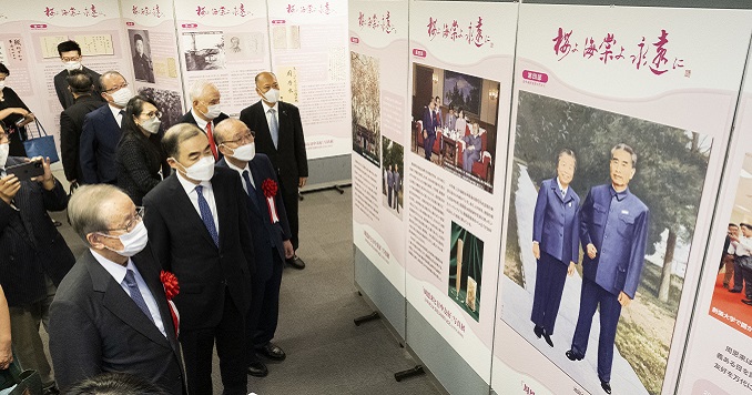 People looking at exhibition panels