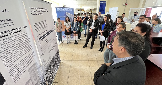 People looking at exhibition panels.