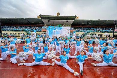 Cheer leaders in Run for Peace T-shirts perform in a stadium