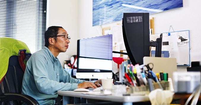 Mr. Terasawa working at his desk