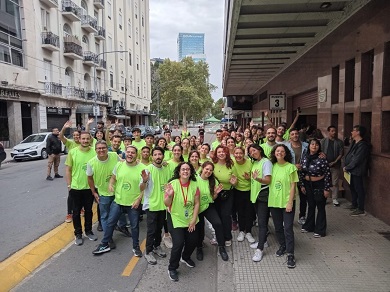 Young people in high-visibility vests smiling at the camera.