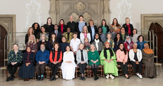 Women from diverse faith traditions gather for a commemorative photograph.