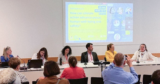 Panelists present projects at a climate conference.