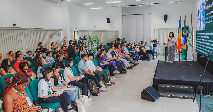 A young person giving a presentation.