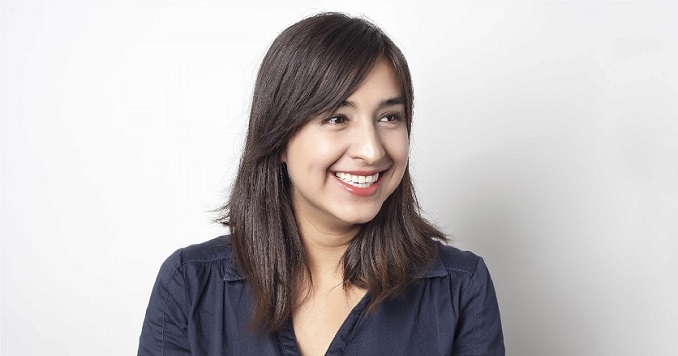 Profile photo of Natalia looking off to the side smiling