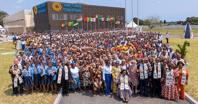 A large group of people outside a building.