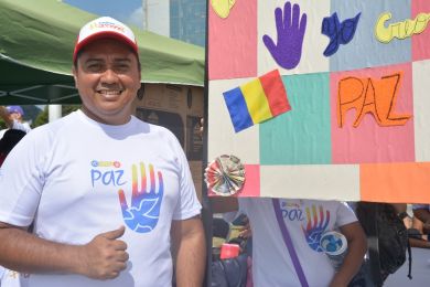 Posed shot of a man next to an event tent