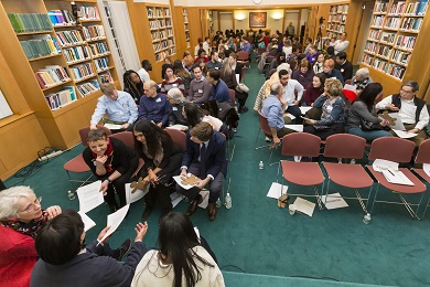Groups of people in dialogue in a hall
