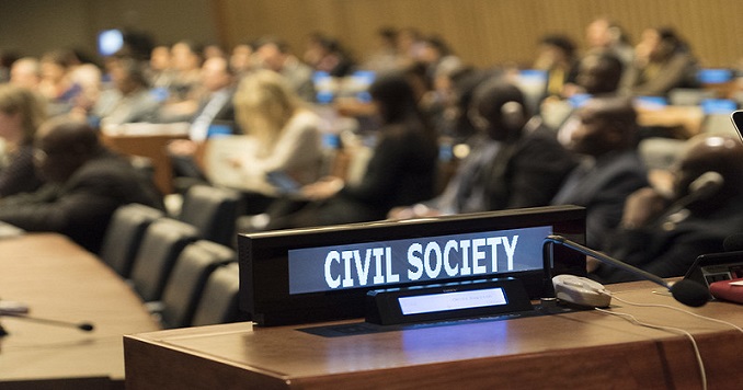 Sign saying “civil society” against blurred background