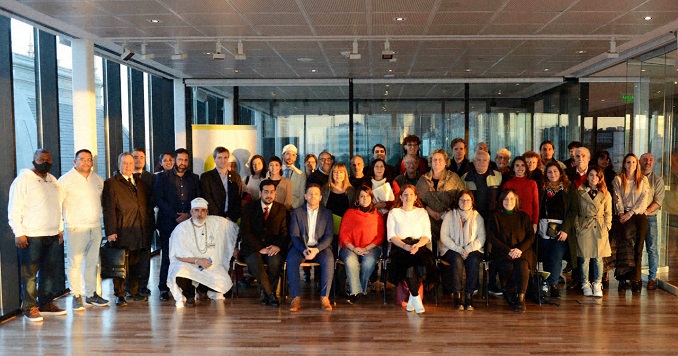 A diverse group of people posing for a commemorative picture