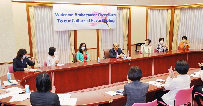 People seated around a large conference table.