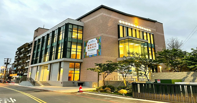 A street-level photo of a building of around five stories